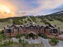 Aerial view of One Ski Hill Place, featuring stunning mountain views and manicured landscaping at 1521 Ski Hill Rd # 8313, Breckenridge, CO 80424