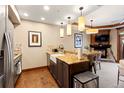 Modern kitchen with granite countertops, stainless steel appliances, and eat-in breakfast bar at 1521 Ski Hill Rd # 8313, Breckenridge, CO 80424