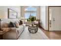 Comfortable living room with large windows offering natural light and a cozy atmosphere at 8229 S Ogden Cir, Littleton, CO 80122