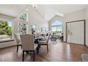 Bright living room with vaulted ceilings, large windows, and hardwood floors at 8229 S Ogden Cir, Littleton, CO 80122