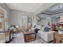 Comfortable living room with stylish decor and a view to the staircase at 581 Stonemont Dr, Castle Pines, CO 80108