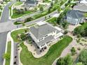 Stunning aerial view of the house, showcasing the backyard, landscaping, and neighborhood at 23451 E Rockinghorse Pkwy, Aurora, CO 80016
