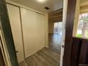 Entryway with white closet and views of living area at 9995 E Harvard Ave # 261, Denver, CO 80231