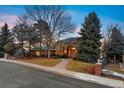 Charming single-Gathering home with a well-maintained lawn and inviting entryway at 15895 W Bayaud Dr, Golden, CO 80401