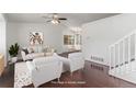 Bright living room showing the open-concept design and hardwood floors at 5733 Whitechapel St, Castle Rock, CO 80104