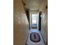 Clean entryway with tile floor and access to the backyard at 2218 Coronado N Pkwy # B, Denver, CO 80229