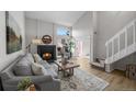 Comfortable living room featuring a fireplace, neutral decor, and bright lighting at 4899 S Dudley St # 19, Littleton, CO 80123