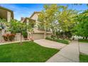 Attractive home with a stone and stucco exterior, neat landscaping, and an ample driveway leading to a two-car garage at 581 Garfield St, Denver, CO 80206