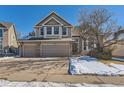 Two-story house with a large driveway and attached two-car garage at 2645 S Kline Cir, Lakewood, CO 80227