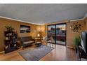 Living room boasts stunning sunset views and a cozy seating area at 1301 Speer Blvd # 410, Denver, CO 80204