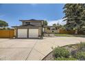 Two-story home with an attached two-car garage, and landscaped front yard at 2380 W 105Th Pl, Northglenn, CO 80234