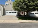 Charming home exterior with a well-manicured lawn and mature tree providing ample shade at 15555 E 40Th Ave # 11, Denver, CO 80239