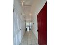 Bright foyer with tile flooring, neutral walls, and high ceilings leading to the main living space at 15555 E 40Th Ave # 11, Denver, CO 80239