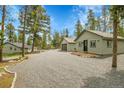 Spacious property with multiple structures, offering ample space for living and storage at 10887 Goodheart Ave, Conifer, CO 80433