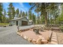 Inviting outdoor area with a fire pit and comfortable seating, ideal for entertaining guests at 10887 Goodheart Ave, Conifer, CO 80433