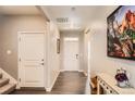 Bright entryway with hardwood floors leading to the living spaces at 8953 Falcon St, Firestone, CO 80504