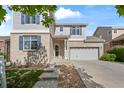 Attractive two-story home with brick accents, an attached two-car garage and landscaped front yard at 1160 S Fultondale Ct, Aurora, CO 80018