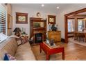 Comfortable living room showcasing hardwood floors, a decorative fireplace, and an open layout at 669 S Washington St, Denver, CO 80209