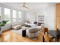 Open concept living area boasting hardwood floors, neutral tones, and modern furnishings at 340 S Lafayette St # 201, Denver, CO 80209