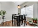 Cozy dining area with a table and four chairs, near window at 3876 Canyon Ranch Rd # 202, Highlands Ranch, CO 80126