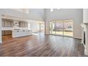 Spacious great room features hardwood flooring, high ceilings, and abundant natural light at 1699 Morgan Dr, Erie, CO 80516