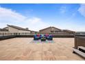 Large rooftop terrace features blue outdoor seating, a hot tub, and expansive views of the surrounding area at 4625 W 50Th Ave # 304, Denver, CO 80212