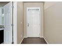 Entryway with hardwood floors, neutral paint, and a white door at 467 S 36Th Ave, Brighton, CO 80601