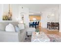Comfortable living room with modern furnishings, an open layout, and natural light flowing through the space at 5735 N Genoa Way # 11-205, Aurora, CO 80019
