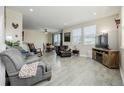 Bright and airy living room with updated flooring and large windows at 9047 Apache Plume Dr # D, Parker, CO 80134