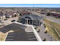Aerial view of the apartment building, ample parking and surrounding neighborhood at 875 E 78Th Ave # 70, Denver, CO 80229