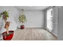 Spacious living room with lots of natural light, wood-look floors, and neutral paint at 6680 E Rustic Dr, Parker, CO 80138