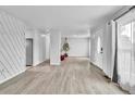 Bright and airy living room with wood-look floors and modern finishes at 6680 E Rustic Dr, Parker, CO 80138