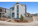 Stylish two-story home boasts modern design with attractive siding and well-maintained landscaping at 8733 Arriba Dr, Littleton, CO 80125