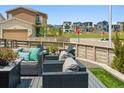 Relaxing outdoor seating area with stylish wicker furniture and plush cushions for cozy gatherings at 8733 Arriba Dr, Littleton, CO 80125
