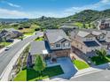 Beautiful two-story home featuring a well-maintained lawn and landscaping at 436 Sage Grouse Cir, Castle Rock, CO 80109