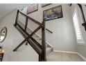 View of staircase with carpeted steps, modern railing, and stylish wall decor at 436 Sage Grouse Cir, Castle Rock, CO 80109