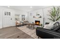 Cozy living room features a stylish fireplace, modern furniture, and lots of natural light at 1858 S Lincoln St, Denver, CO 80210