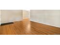 Spacious living room featuring gleaming hardwood floors and neutral wall colors at 2698 S Niagara St, Denver, CO 80224