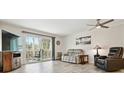 Bright and airy living room with sliding door access to balcony, neutral walls and flooring at 795 S Alton Way # 4C, Denver, CO 80247