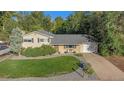 Aerial view of a well-maintained home with a lush green lawn and landscaped surroundings at 3582 Wright St, Wheat Ridge, CO 80033