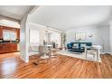 Bright and airy living room with hardwood floors and stylish contemporary furnishings at 3582 Wright St, Wheat Ridge, CO 80033