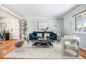 Cozy living room with a plush sofa, decorative accents, and a bright, welcoming ambiance at 3582 Wright St, Wheat Ridge, CO 80033