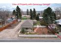Aerial view of the property highlighting the detached garage and backyard at 7794 Louviers Blvd, Louviers, CO 80131
