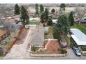 Birds-eye view of property highlighting fenced yard and detached garage with driveway at 7794 Louviers Blvd, Louviers, CO 80131