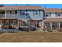 Charming townhome with a combination brick and siding facade and front yard at 2540 E Geddes Pl, Centennial, CO 80122