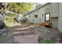 Backyard with stone steps and patio area, ideal for outdoor relaxation and entertaining at 100 Wildcat Ln, Boulder, CO 80304