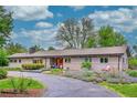 Single story home with attractive front yard, sidewalk, and covered porch at 4701 Homestead St, Bow Mar, CO 80123