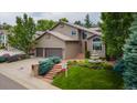 Inviting two-story home with landscaped front yard, fountain, and 