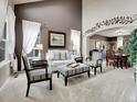 Inviting living room boasts natural light, neutral tones, and decorative accents at 10062 Eagle Valley Way, Highlands Ranch, CO 80129