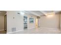 Open floor plan to kitchen and dining area featuring light wood floors, and neutral paint at 9995 E Harvard Ave # 246, Denver, CO 80231